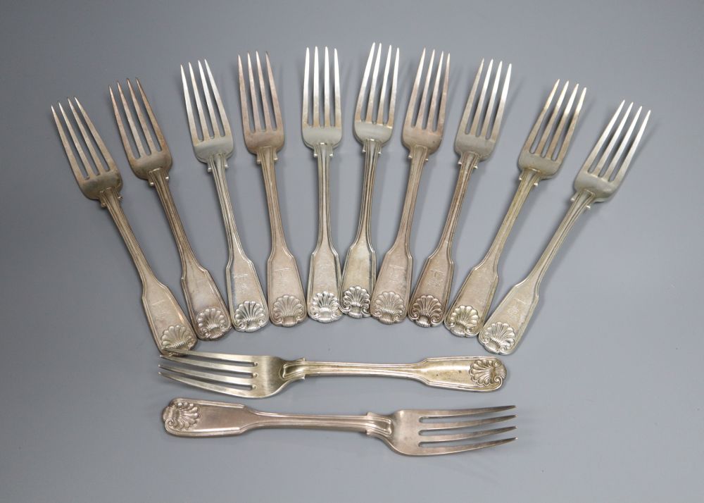 A matched set of twenty two George IV and later silver fiddle, thread and shell pattern dessert forks
